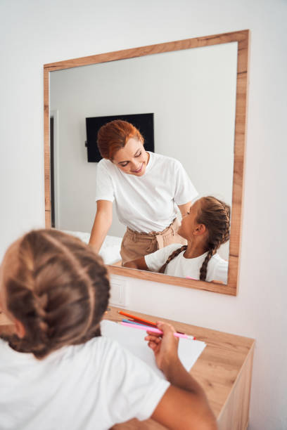 istock Mom asking her daughter about her success in drawing 1292584481