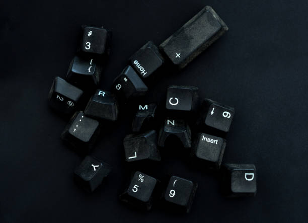 istock dirty and dusty black computer keyboard keys on a black background 1292584629