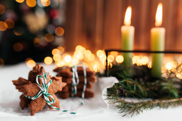 istock Christmas decorations with candles, fir branches and gingerbread 1292585793