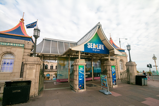 The entrance to Brighton Sea Life Aquarium in East Sussex, England with people visible in the background