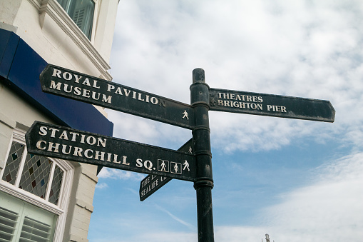 Brighton Directional Sign in East Sussex, England, pointing to the Royal Pavilion, Brighton Pier and Churchill Square