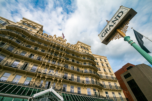 A place sign overlooking the Grand Hotel in Brighton. This is a privately owned commercial enterprise on the Brighton seafront, and also the place UK prime minister Margaret Thatcher was targeted in an assassination attempt in 1984 by the IRA.