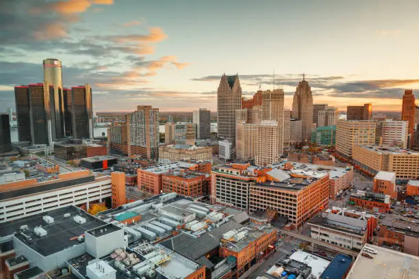 Detroit, Michigan, USA downtown skyline from above at dusk.