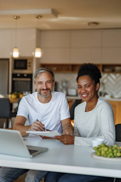 istock Man and woman solving finance things. 1292589720