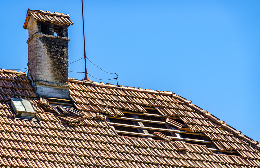 old chimney at a roof - photo