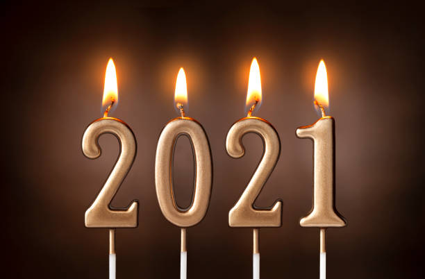 istock Happy new year 2021. Lighted candles. 1292591475