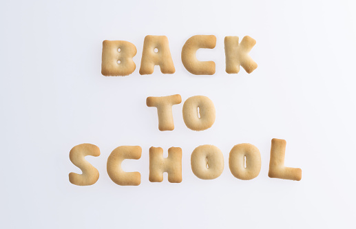 Biscuit text back to school on white background.