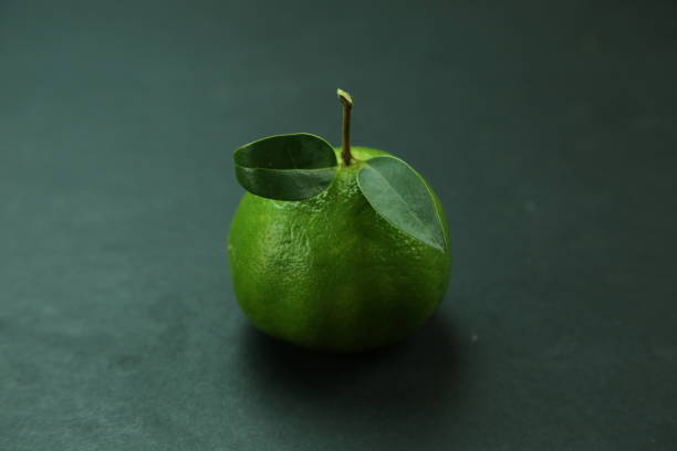 Green sweet tangerines growing with background. High quality photo