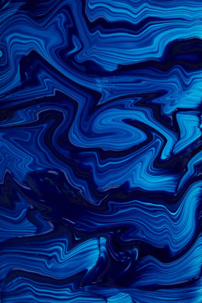 istock Abstract fluid liquid blue acrylic paint background texture 1292592598