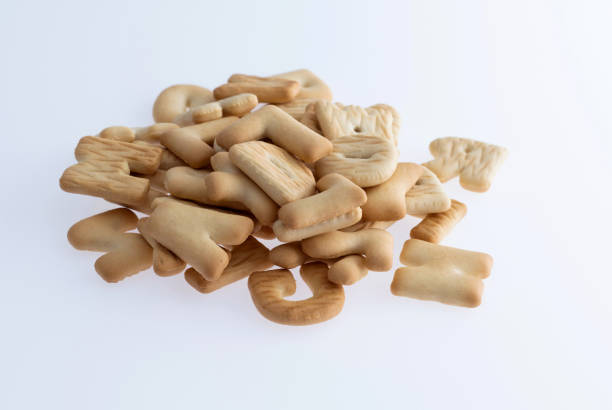 istock Heap of letter biscuits on white background 1292592843