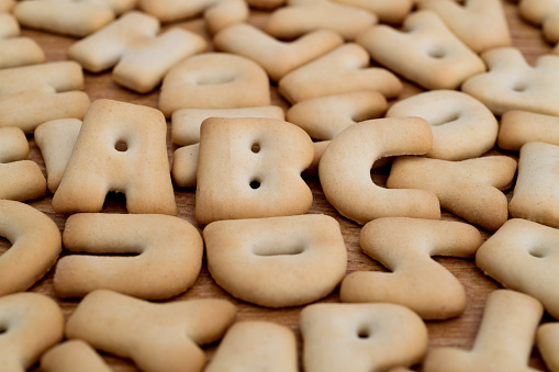 Heap of letter biscuits on the table.