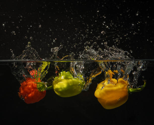 Free Stock Photo of Bell pepper splash in water on black | Download ...