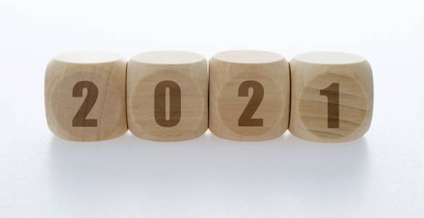 istock Wooden cubes with word 2021 1292595236