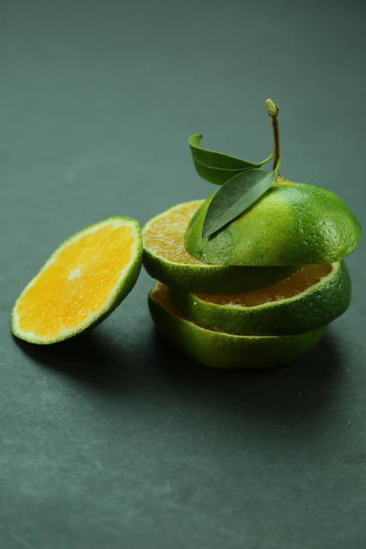 Green sweet tangerines growing with background