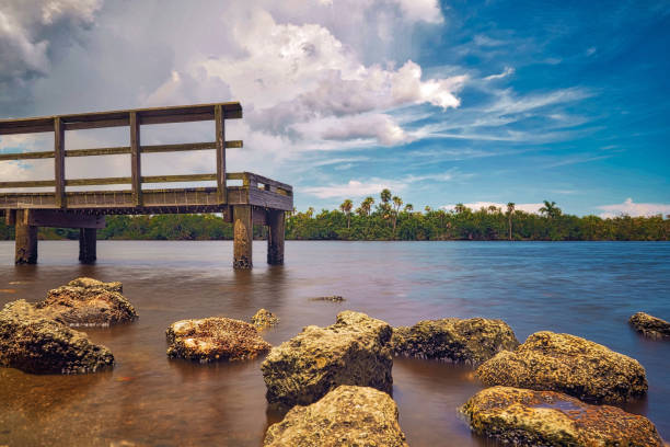 Beautiful pier scene with rocks on the shore. in Port St. Lucie, FL, United States
