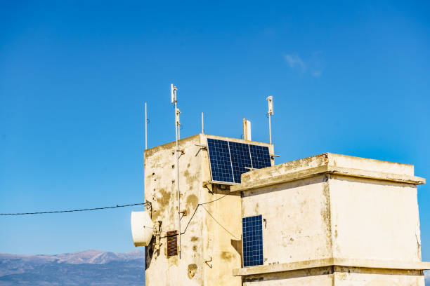 istock House wall with solar photovoltaic panels. 1292599301