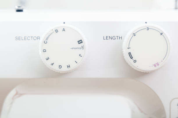 istock Closeup of mode knobs of sewing machine 1292599581