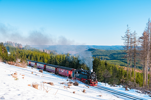 Harz national park Germany, Steam train on the way to Brocken through winter landscape, Famous steam train throught the winter mountain . Brocken, Harz National Park Mountains in Germany