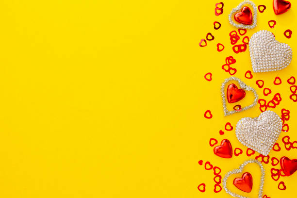 istock Valentine's Day template, yellow background with hearts, copy space. 1292602363