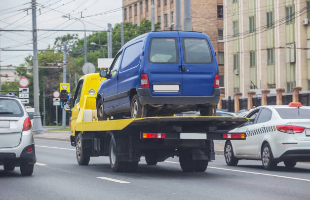 istock Tow truck transporting a broken car 1292603333