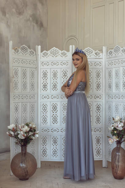 istock Young blonde in a beautiful dress 1292605516
