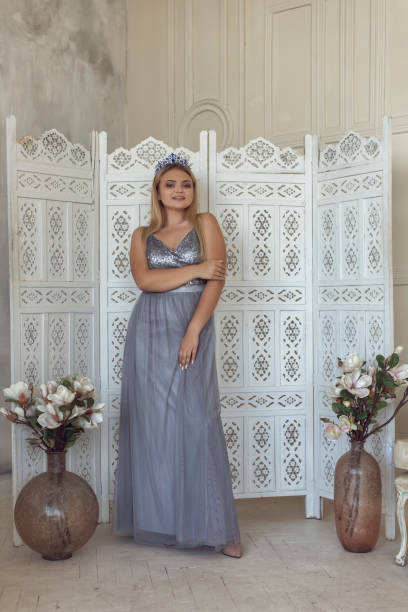 istock Young blonde in a beautiful dress 1292605528