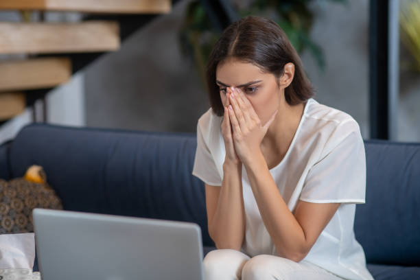 istock Sad and concentrated woman working with her laptop 1292605818