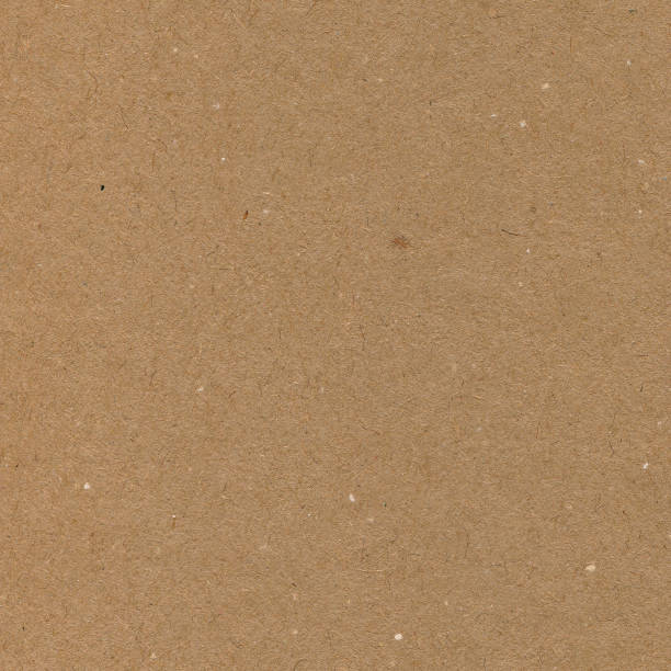 istock Wrapping paper copy space background, dark tan beige brown cardboard texture, natural rough textured pattern macro closeup 1292607442