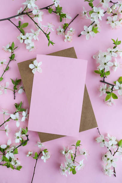 istock mockup of a spring postcard. blossoming cherry branch and place for text. congratulation. invitation 1292608476