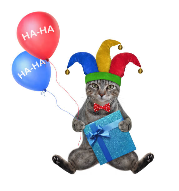 istock Cat gray clown with balloons 1292609285