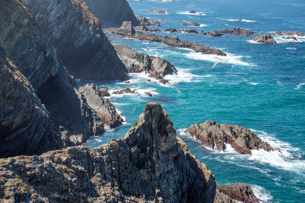 istock Sea coast with rock formations and waves 1292609354