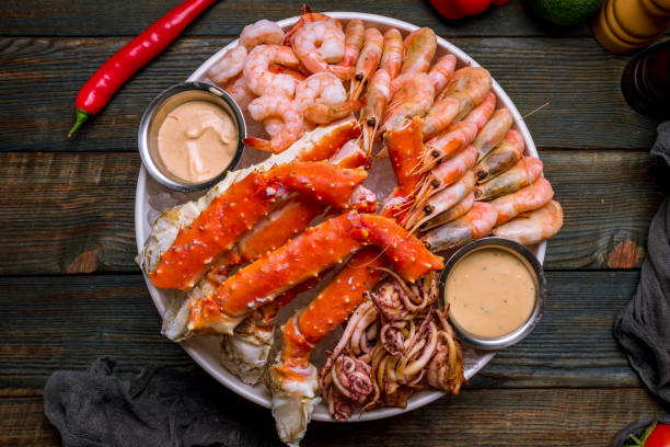 istock assorted seafood on ice, crab, shrimps, prawns, squid 1292610412