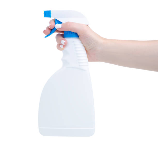 istock White cleaning bottle spray in hand 1292611912