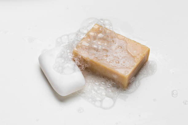 istock Soap bar and foam on white background, top view. Mockup for design 1292612700