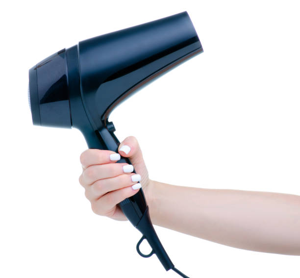 istock Black hair dryer in hand 1292613025