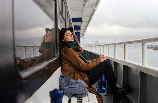 Young Caucasian woman traveling on ferry in Istanbul