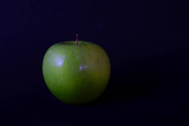 istock apple fruit isolated on black color. organic farmed fruit. 1292614181