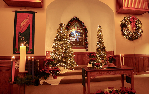 A small church's sanctuary decorated for Christmas