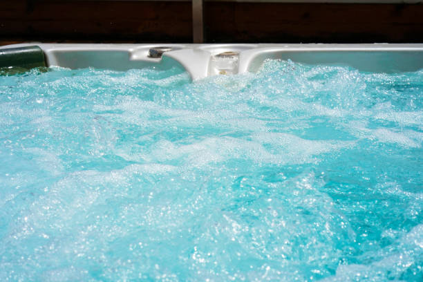 istock Hotel staff worker cleaning hot tub 1292617519