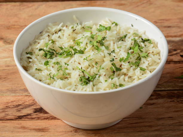istock Cumin rice or Jeera Rice is a popular Indian main course item made using Basmati rice flavored with fried cumin seeds and basic spices, selective focus 1292618289