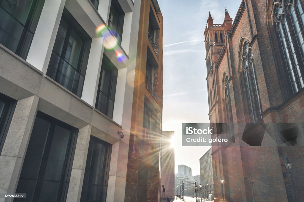 new residential architecture in Central Berlin beside historic Friedrichwerdersche Church new residential architecture at Werdersche Markt in Central Berlin beside Friedrichwerdersche Church under sunny december sky Old Stock Photo