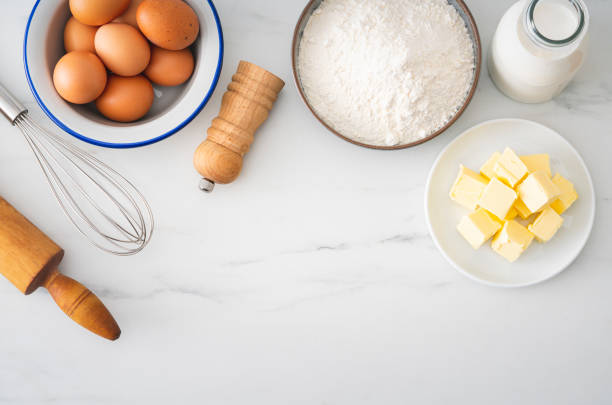 istock Baking homemade bread on white kitchen worktop with ingredients for cooking 1292620008