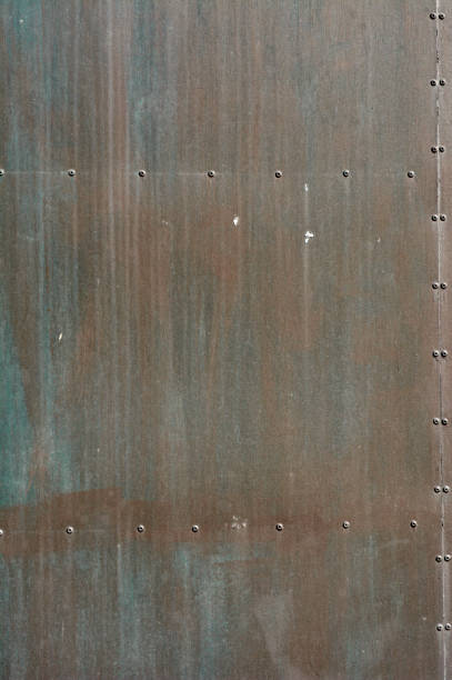 istock iron door texture, rust, with red, blue, brown colors, plates glued with rivets 1292620018