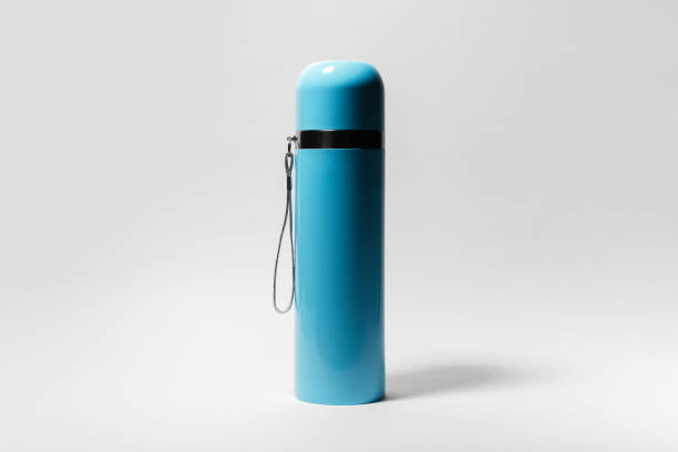 istock Close-up of blue thermos on white background. 1292622174