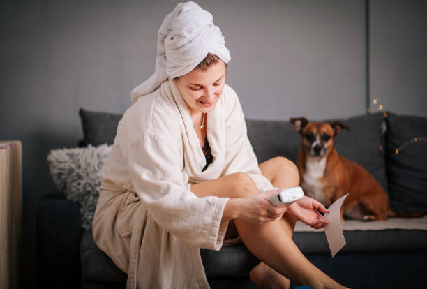 istock Woman Waxing Legs at Home 1292622480