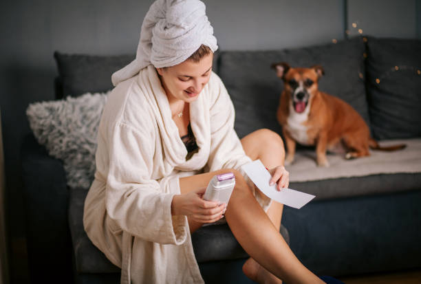 istock Woman Waxing Legs at Home 1292622481