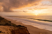 beautiful sunset with beach and sand dunes on the Alentejo coast of Portugal