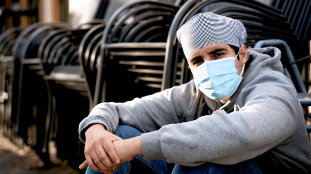 istock Serious pensive Young cook posing wearing protective face mask 1292624421