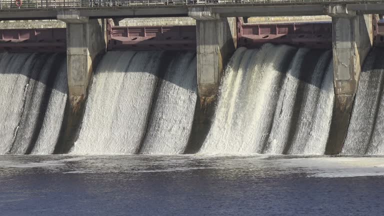 water dam drained from outlet pipe of the dam where is the hydropower electrical generation, Volkhov HYDROELECTRIC POWER station-hydro power station on river Volkhov, Russia