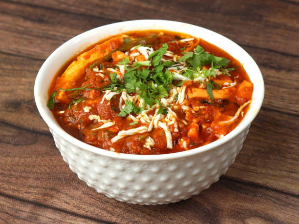 istock Paneer lababdar, is a famous indian dish, served over a rustic wooden background, selective focus 1292627500